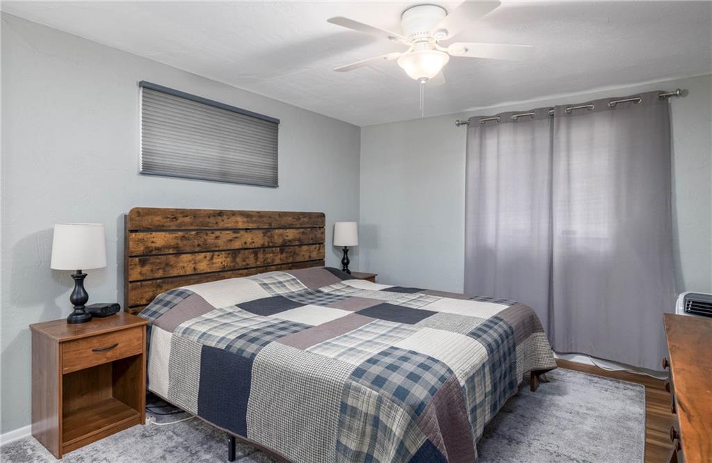 1420 Reissing Road McDonald, PA 15057 - Photo 12 of 33 The master bedroom offers a calm retreat with clean lines, soft natural light enhanced by overhead ceiling fan. There is plenty of room for relaxation.