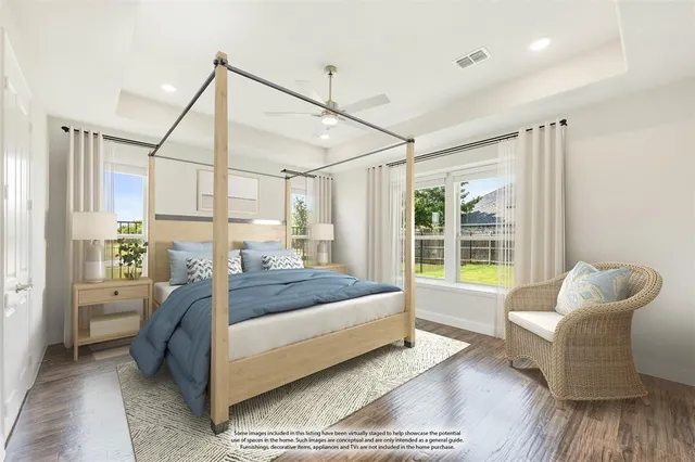 a bedroom with a bed and a couch