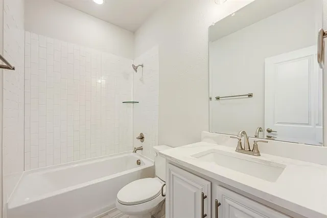 a bathroom with a sink a toilet and a bathtub