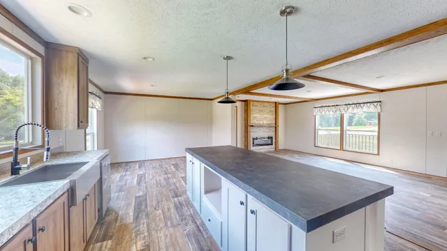 a kitchen with a stove a sink and a refrigerator