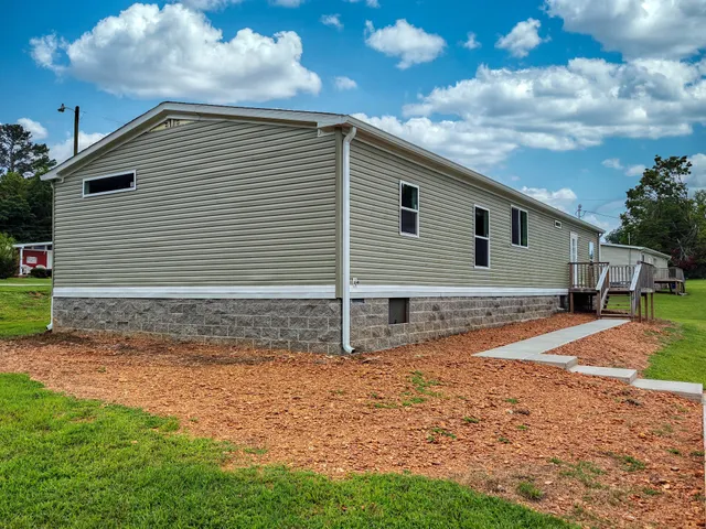a view of a backyard of the house