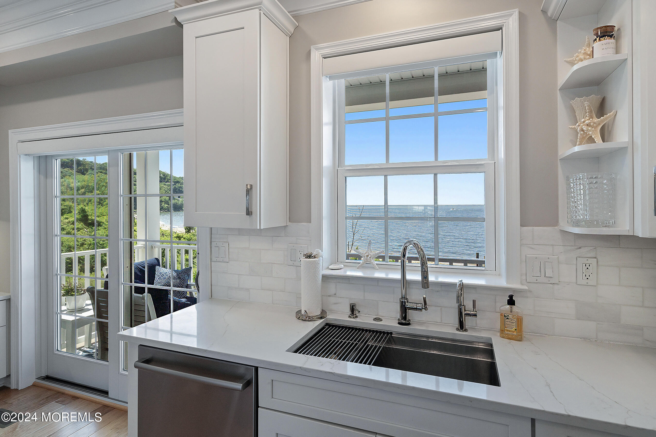 8 Lighthouse Point Road, Unit 703 Highlands, NJ 07732 - Photo 11 of 43 a kitchen with a sink and large window