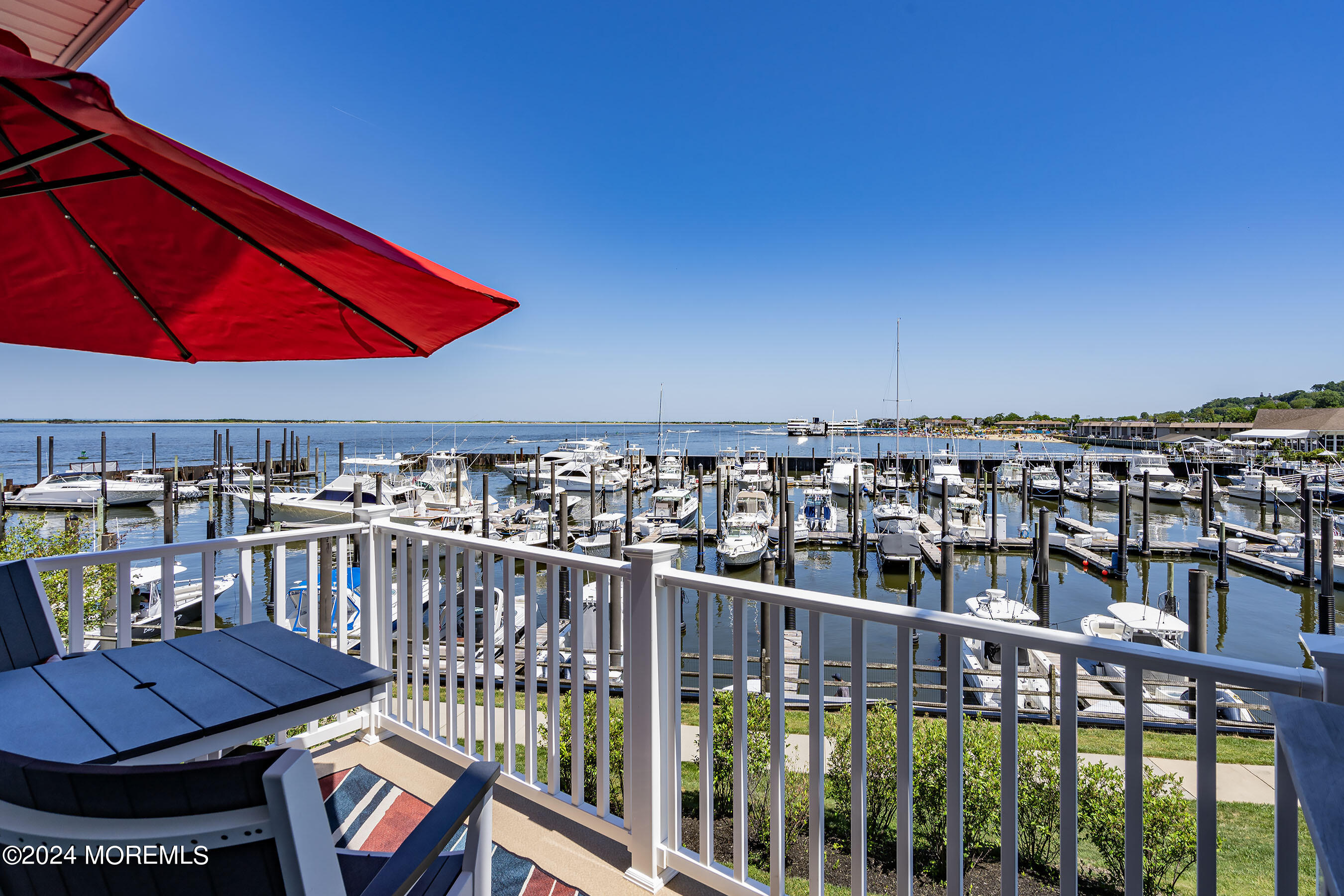 8 Lighthouse Point Road, Unit 703 Highlands, NJ 07732 - Photo 20 of 43 a view of a balcony with chairs
