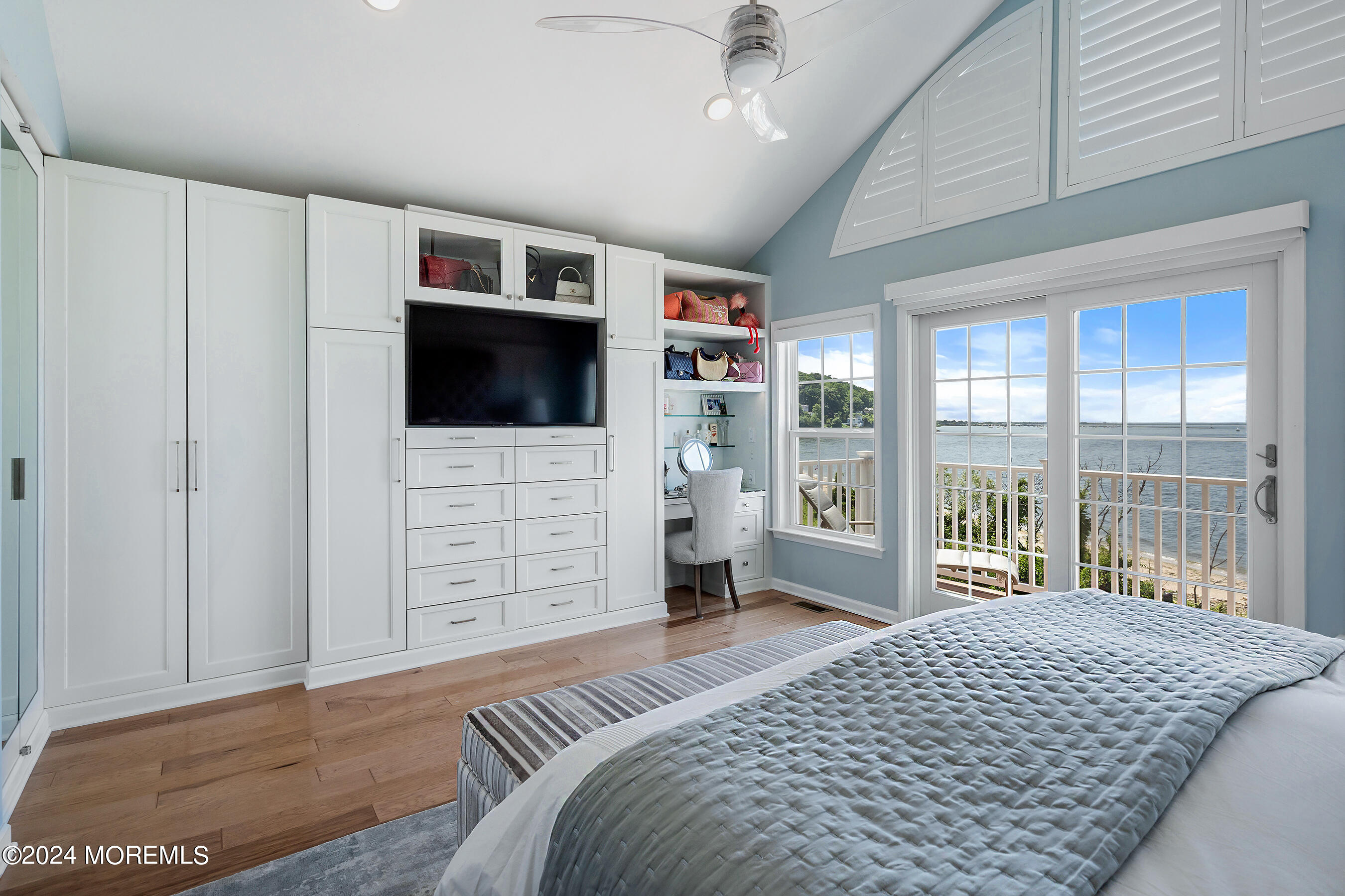 8 Lighthouse Point Road, Unit 703 Highlands, NJ 07732 - Photo 26 of 43 a bedroom with a bed and a flat screen tv