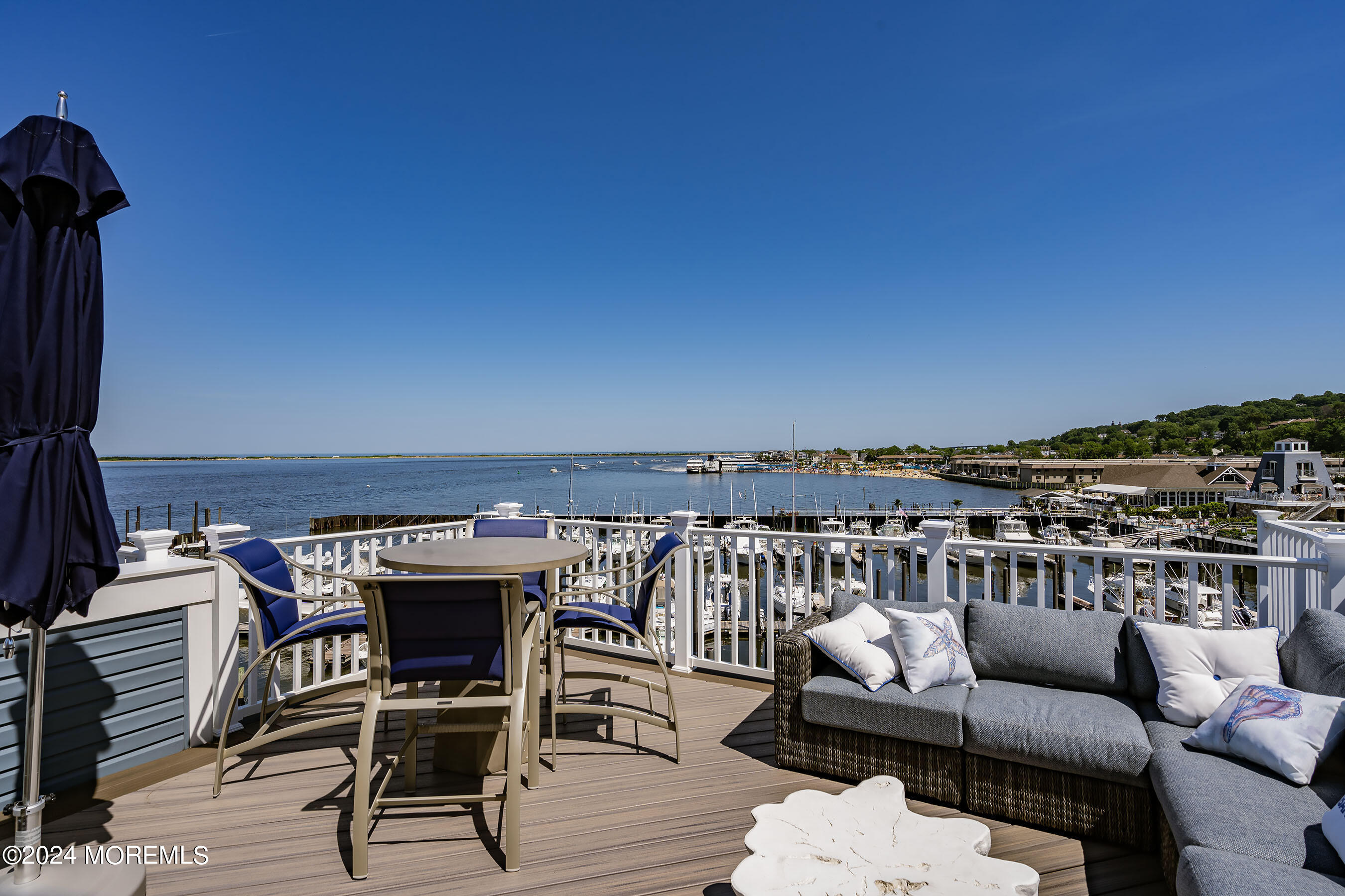8 Lighthouse Point Road, Unit 703 Highlands, NJ 07732 - Photo 35 of 43 a view of a terrace with furniture