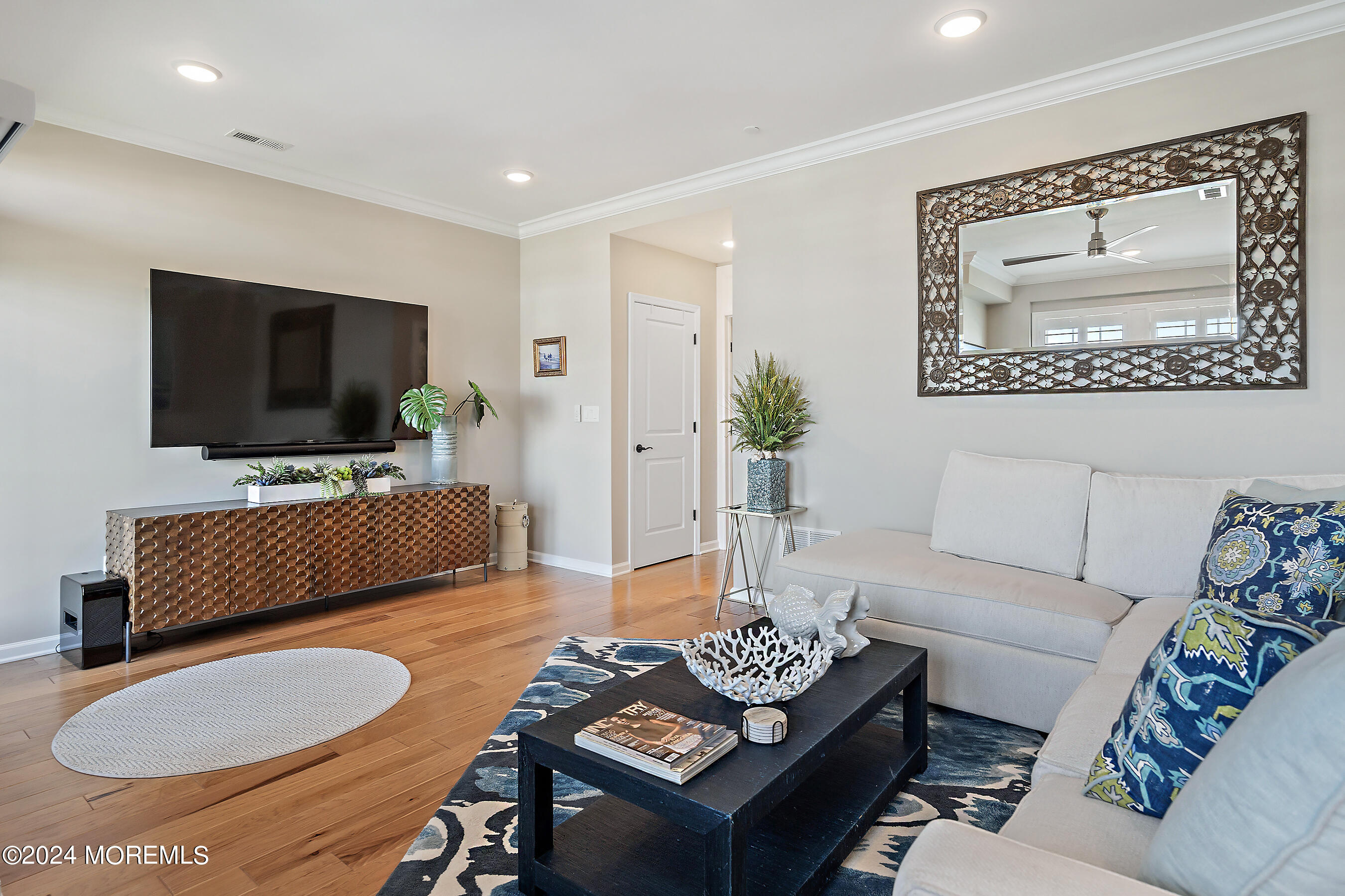 8 Lighthouse Point Road, Unit 703 Highlands, NJ 07732 - Photo 39 of 43 a living room with furniture and a flat screen tv