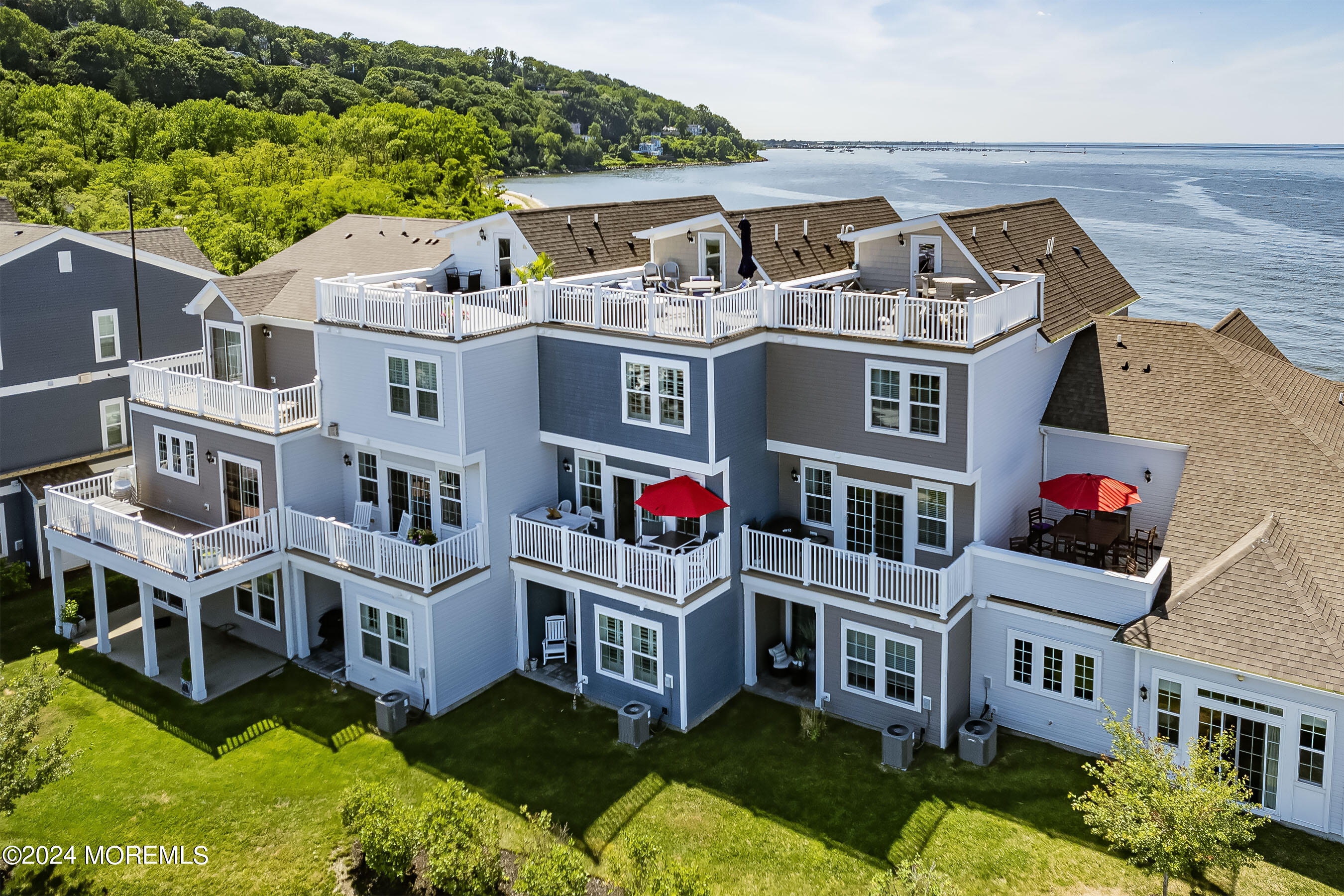 8 Lighthouse Point Road, Unit 703 Highlands, NJ 07732 - Photo 41 of 43 an aerial view of residential houses with yard