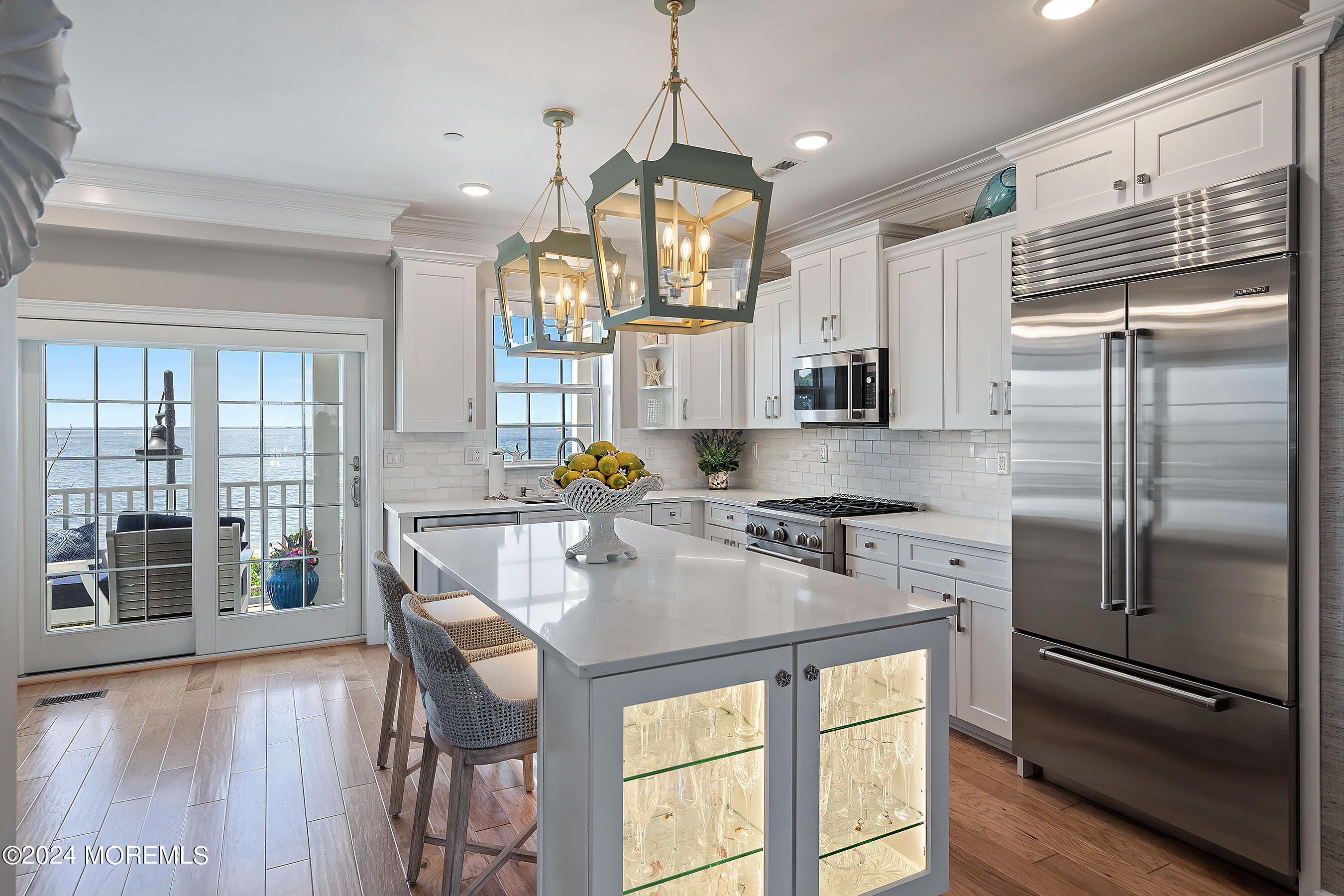 8 Lighthouse Point Road, Unit 703 Highlands, NJ 07732 - Photo 8 of 43 a kitchen with stainless steel appliances granite countertop a refrigerator a stove and a wooden floors