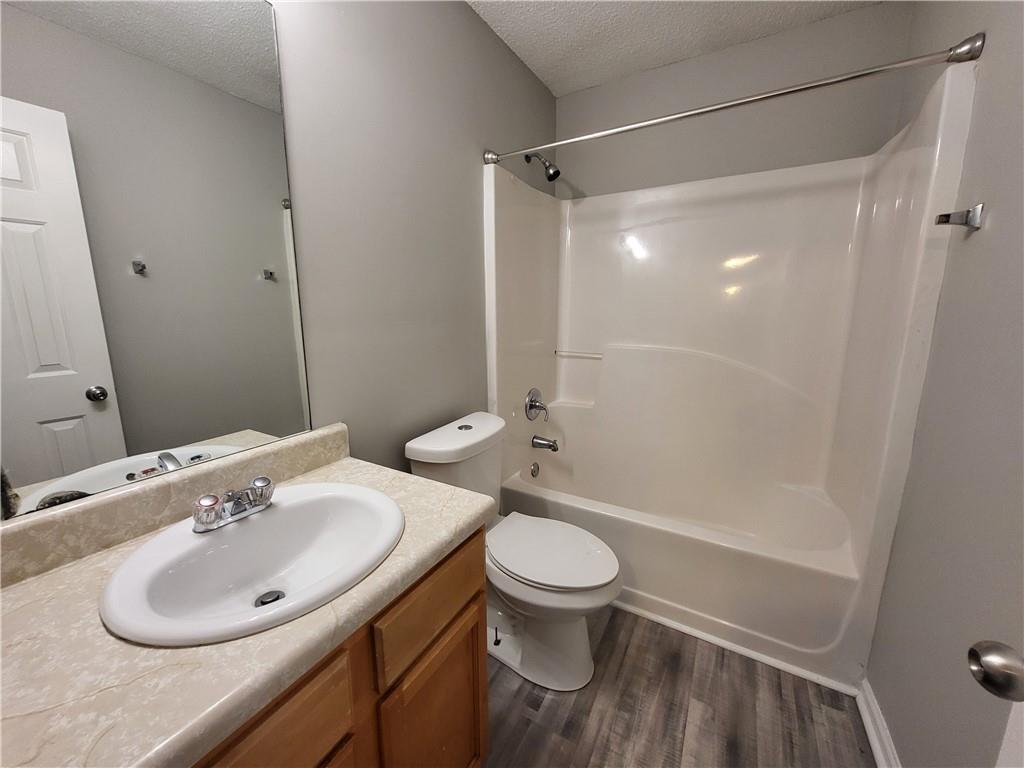 4234 Winston Circle Atlanta, GA 30349 - Photo 15 of 19 a bathroom with a sink toilet and shower