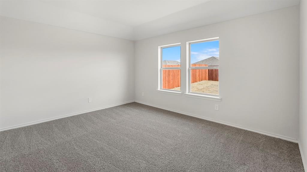 1969 Freeman Street Tyler, TX 75704 - Photo 12 of 30 Spacious room with gray carpet and white walls