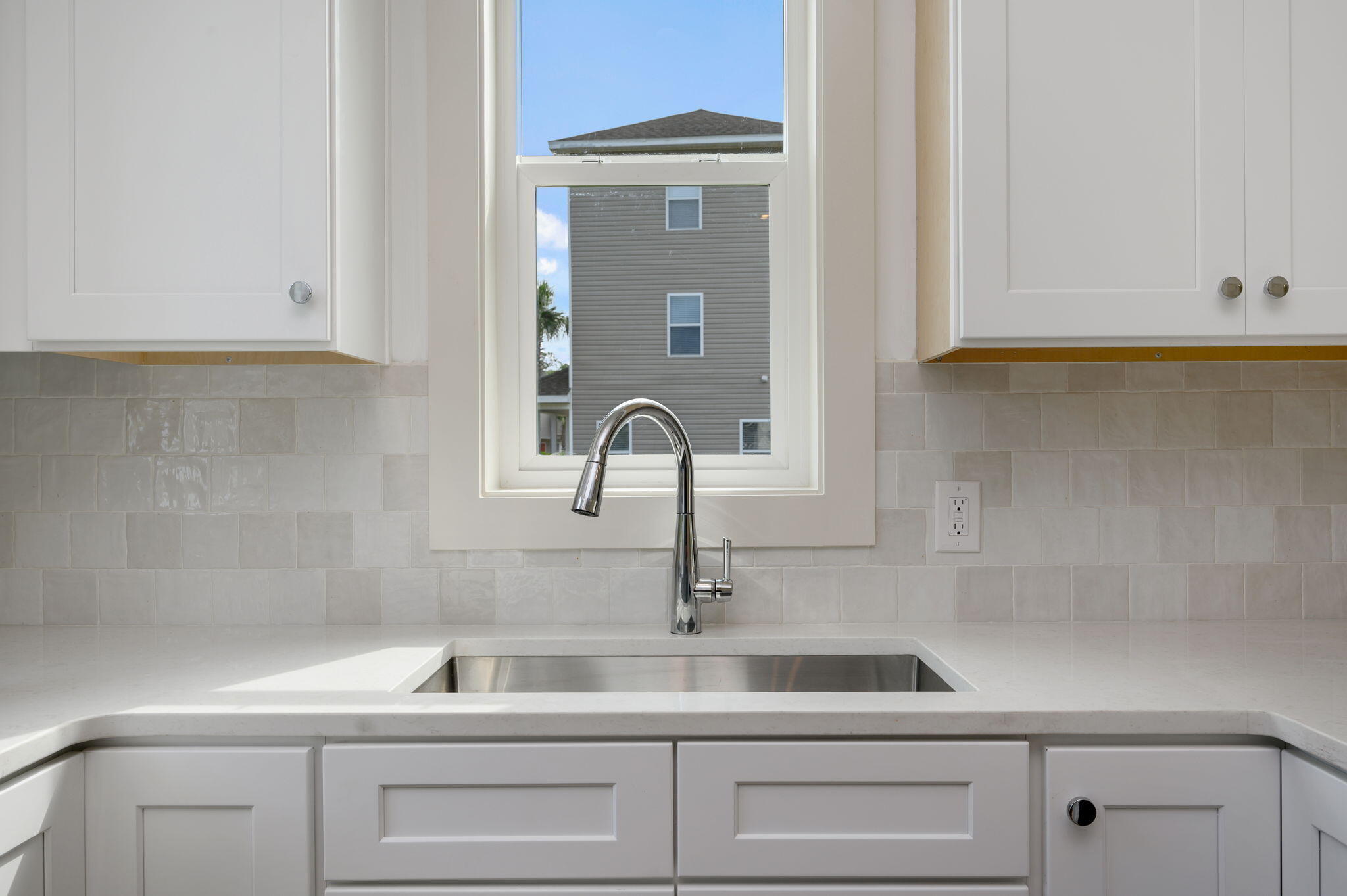 114 Enchanted Way Santa Rosa Beach, FL 32459 - Photo 11 of 33 a kitchen with a sink and cabinets