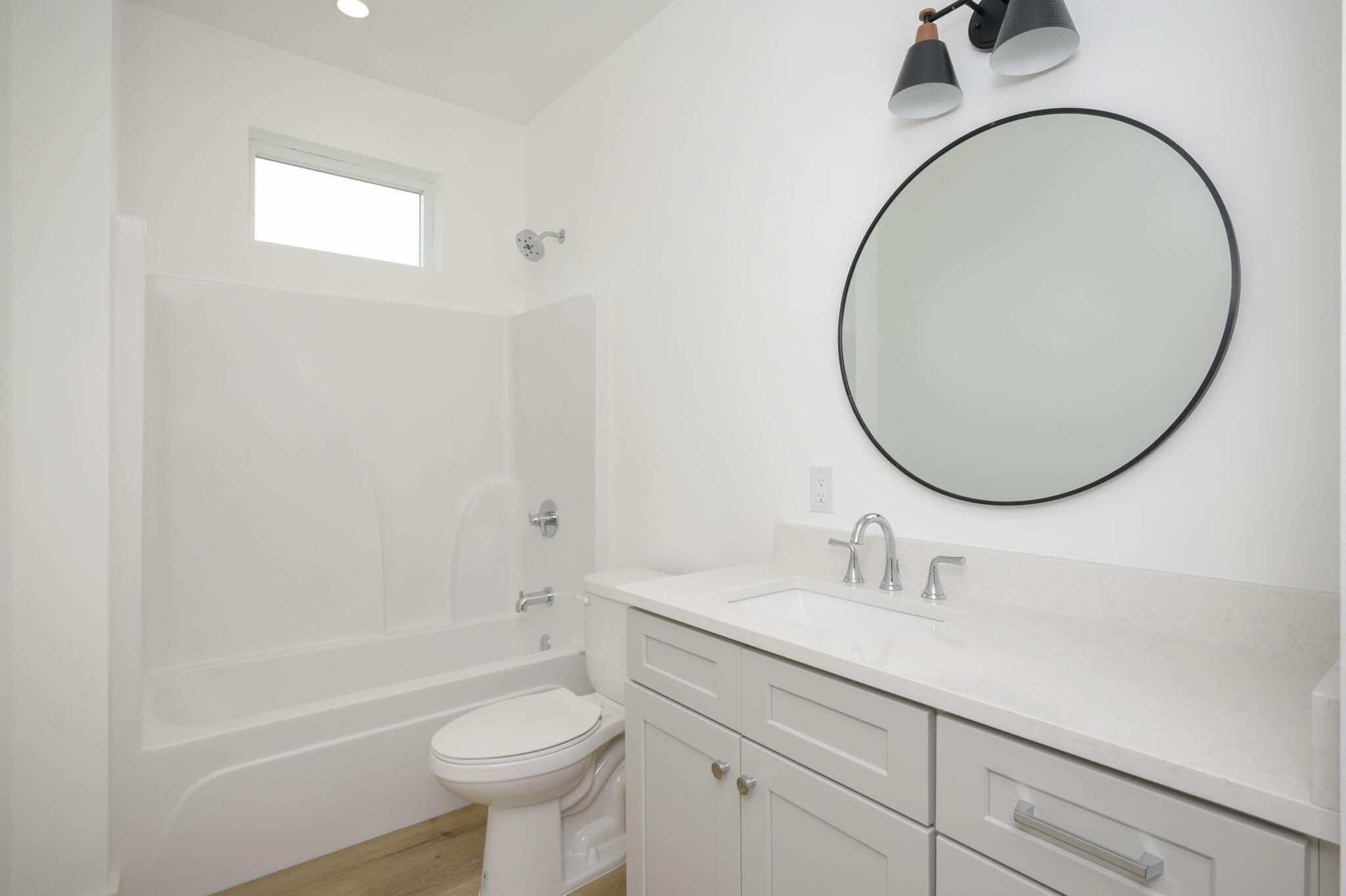 114 Enchanted Way Santa Rosa Beach, FL 32459 - Photo 19 of 33 a bathroom with a sink a toilet and a mirror