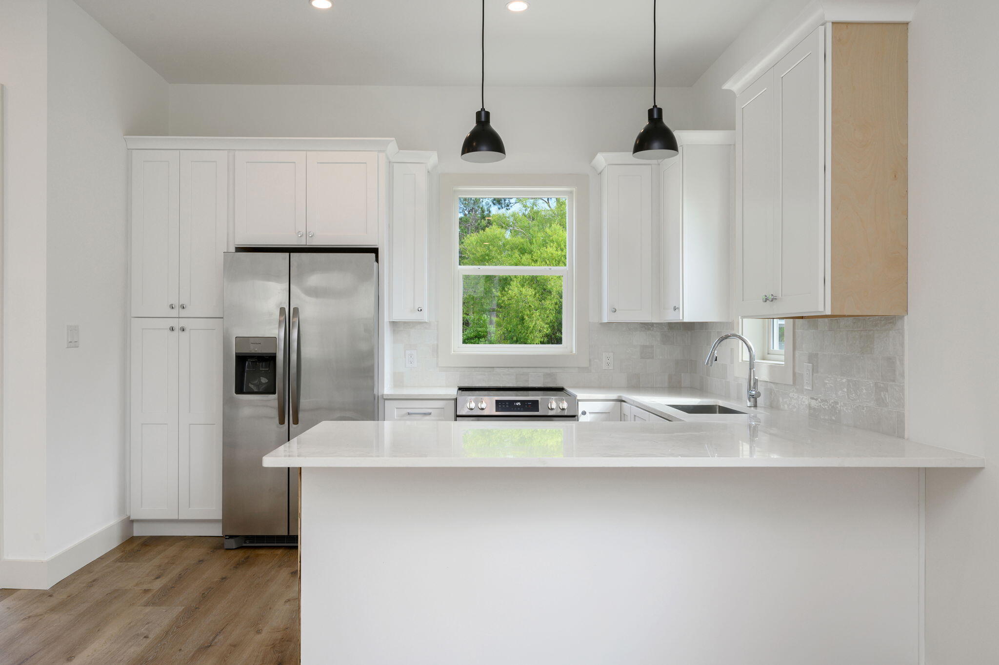 114 Enchanted Way Santa Rosa Beach, FL 32459 - Photo 2 of 33 a kitchen with stainless steel appliances a counter space and a window