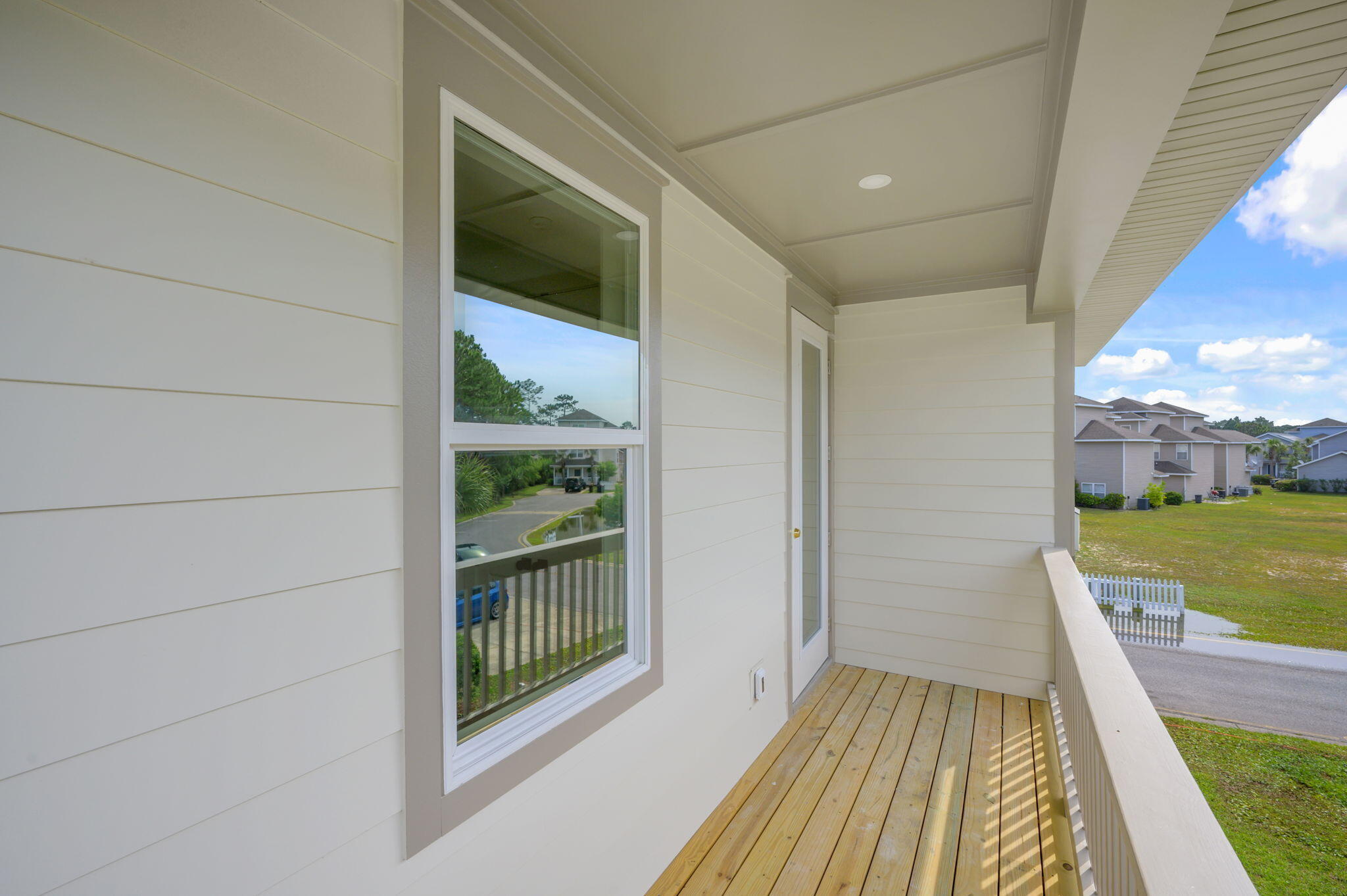 114 Enchanted Way Santa Rosa Beach, FL 32459 - Photo 27 of 33 a view of a balcony with wooden floor