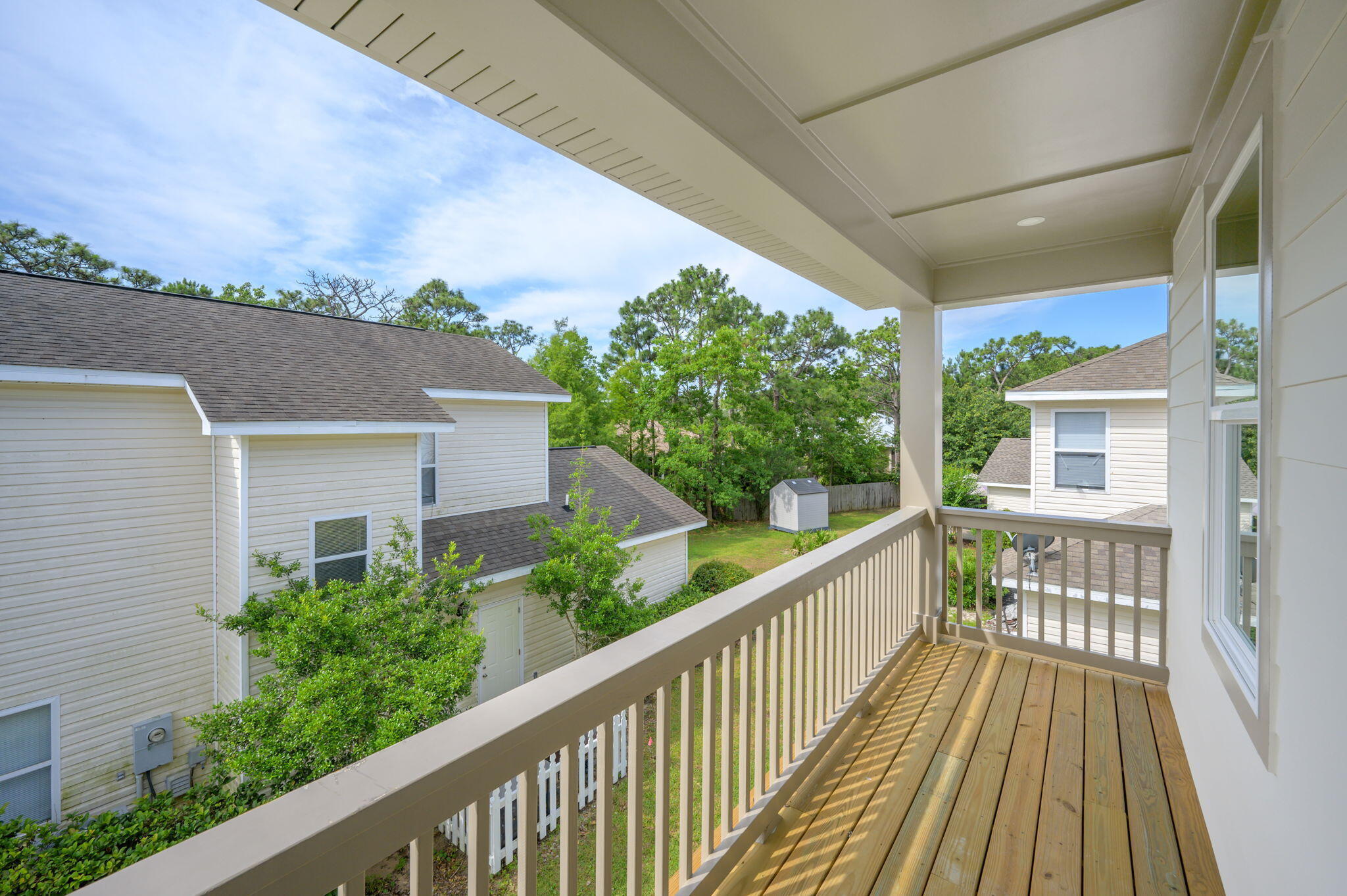 114 Enchanted Way Santa Rosa Beach, FL 32459 - Photo 28 of 33 a view of a balcony with wooden floor