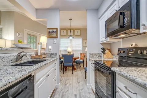 a kitchen with a stove and a microwave