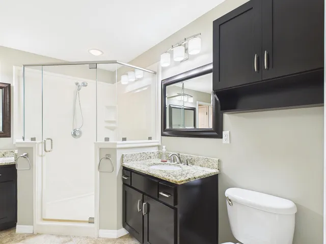 a bathroom with a sink vanity and a mirror