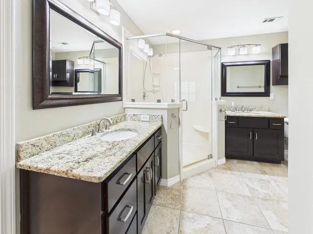 a living room with furniture and a ceiling fan