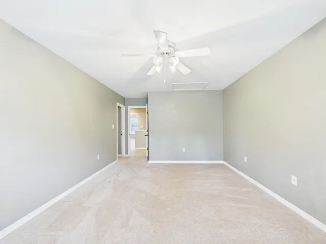a view of a hallway with washer and dryer