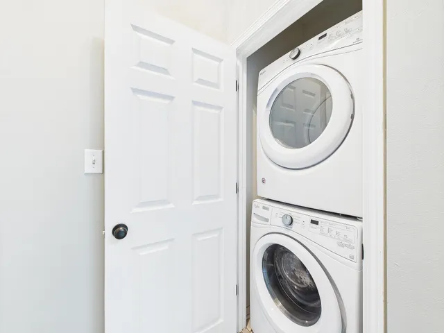 a view of a wooden balcony with a yard