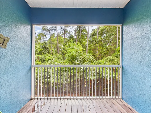 a front view of a house with a garden and plants