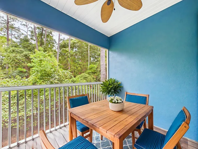 a view of a livingroom with a ceiling fan and window
