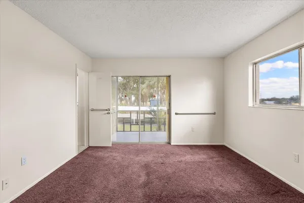a view of an empty room with a window