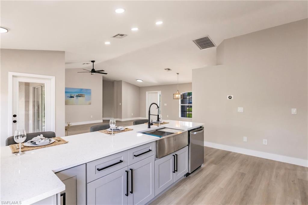 18289 Hepatica Road Fort Myers, FL 33967 - Photo 15 of 45 a kitchen with a sink cabinets and wooden floor