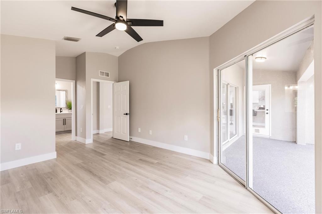 18289 Hepatica Road Fort Myers, FL 33967 - Photo 20 of 45 a view of a big room with wooden floor and a ceiling fan