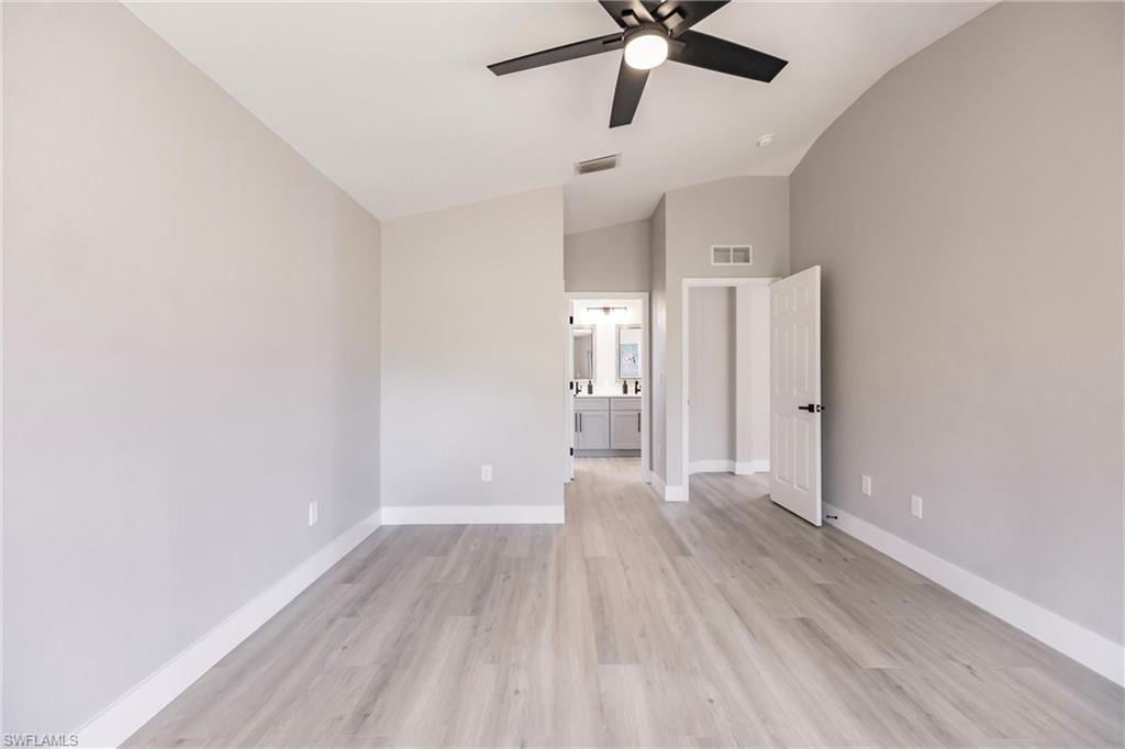 18289 Hepatica Road Fort Myers, FL 33967 - Photo 21 of 45 wooden floor in an empty room with a window