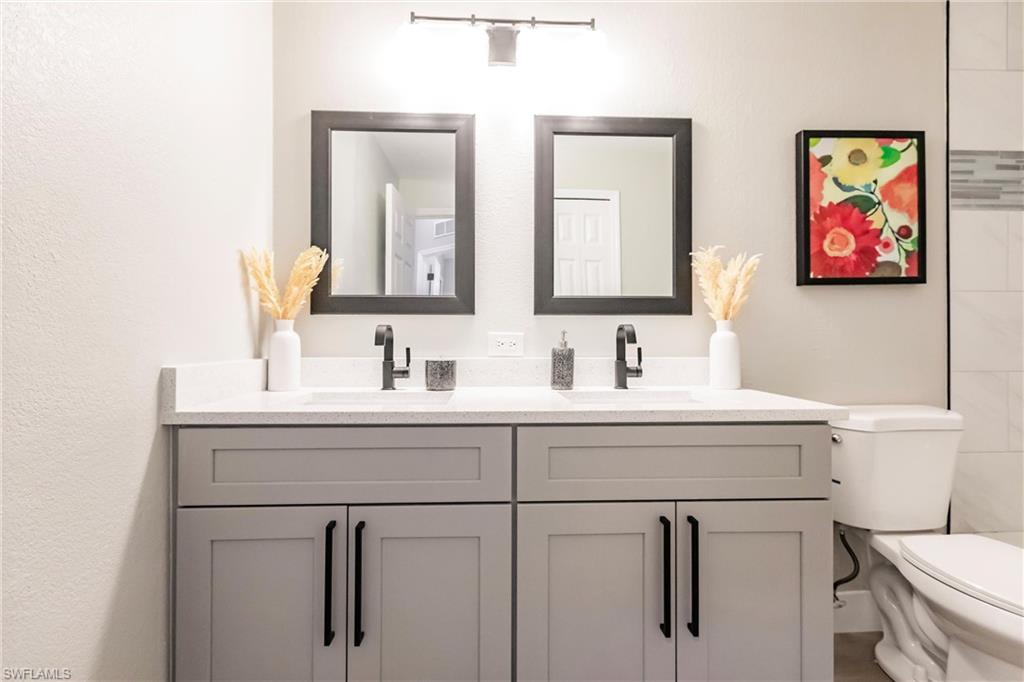 18289 Hepatica Road Fort Myers, FL 33967 - Photo 31 of 45 a bathroom with a sink and a toilet