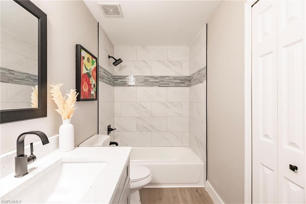 18289 Hepatica Road Fort Myers, FL 33967 - Photo 32 of 45 a bathroom with a sink and a mirror