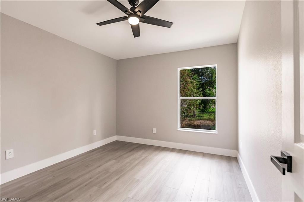 18289 Hepatica Road Fort Myers, FL 33967 - Photo 33 of 45 an empty room with a window and a fan