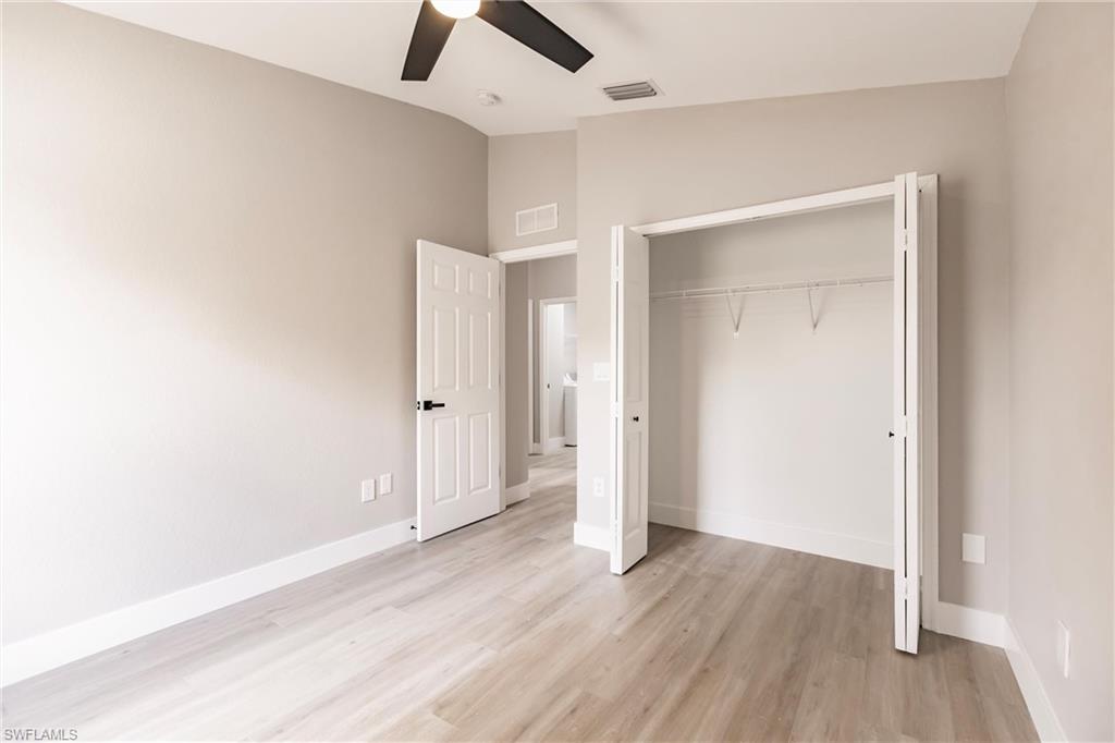 18289 Hepatica Road Fort Myers, FL 33967 - Photo 34 of 45 an empty room with wooden floor