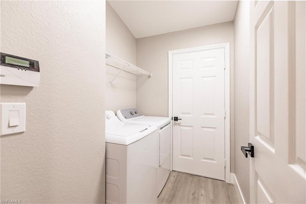 18289 Hepatica Road Fort Myers, FL 33967 - Photo 36 of 45 a view of a bathroom with a sink dryer and washer