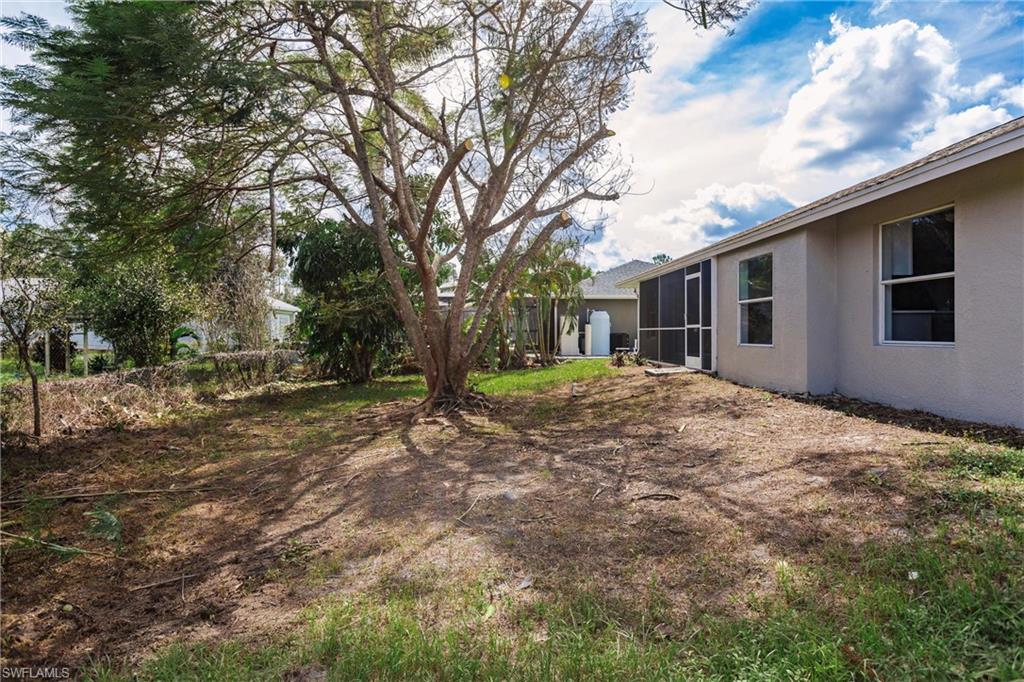 18289 Hepatica Road Fort Myers, FL 33967 - Photo 45 of 45 a backyard of a house with large trees
