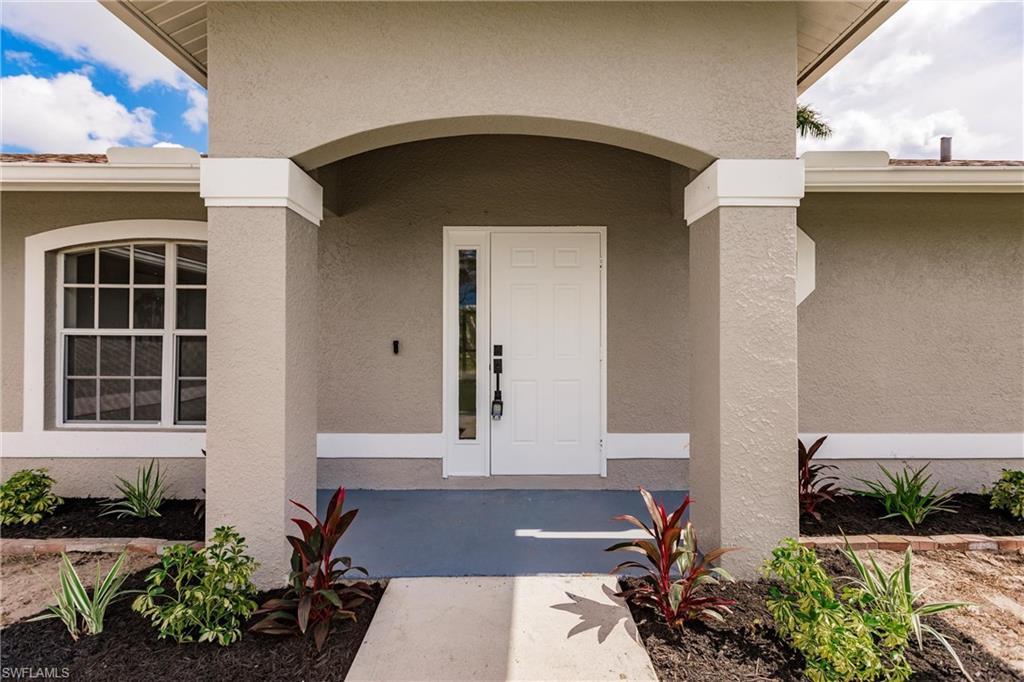 18289 Hepatica Road Fort Myers, FL 33967 - Photo 5 of 45 a front view of a house with a yard