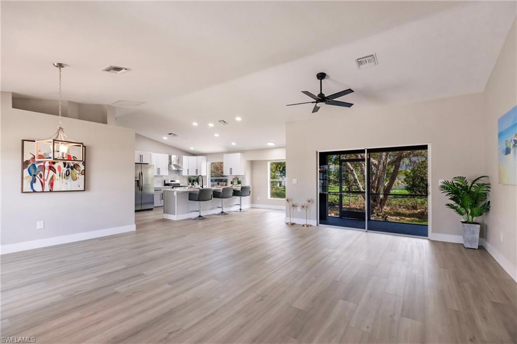 18289 Hepatica Road Fort Myers, FL 33967 - Photo 6 of 45 a view of a livingroom with furniture a ceiling fan and window