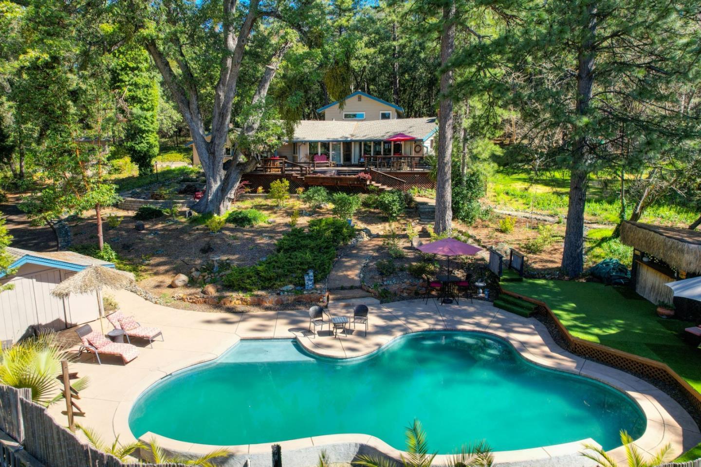 19630 Charleston Road Volcano, CA 95689 - Photo 1 of 70 a swimming pool with outdoor seating and yard