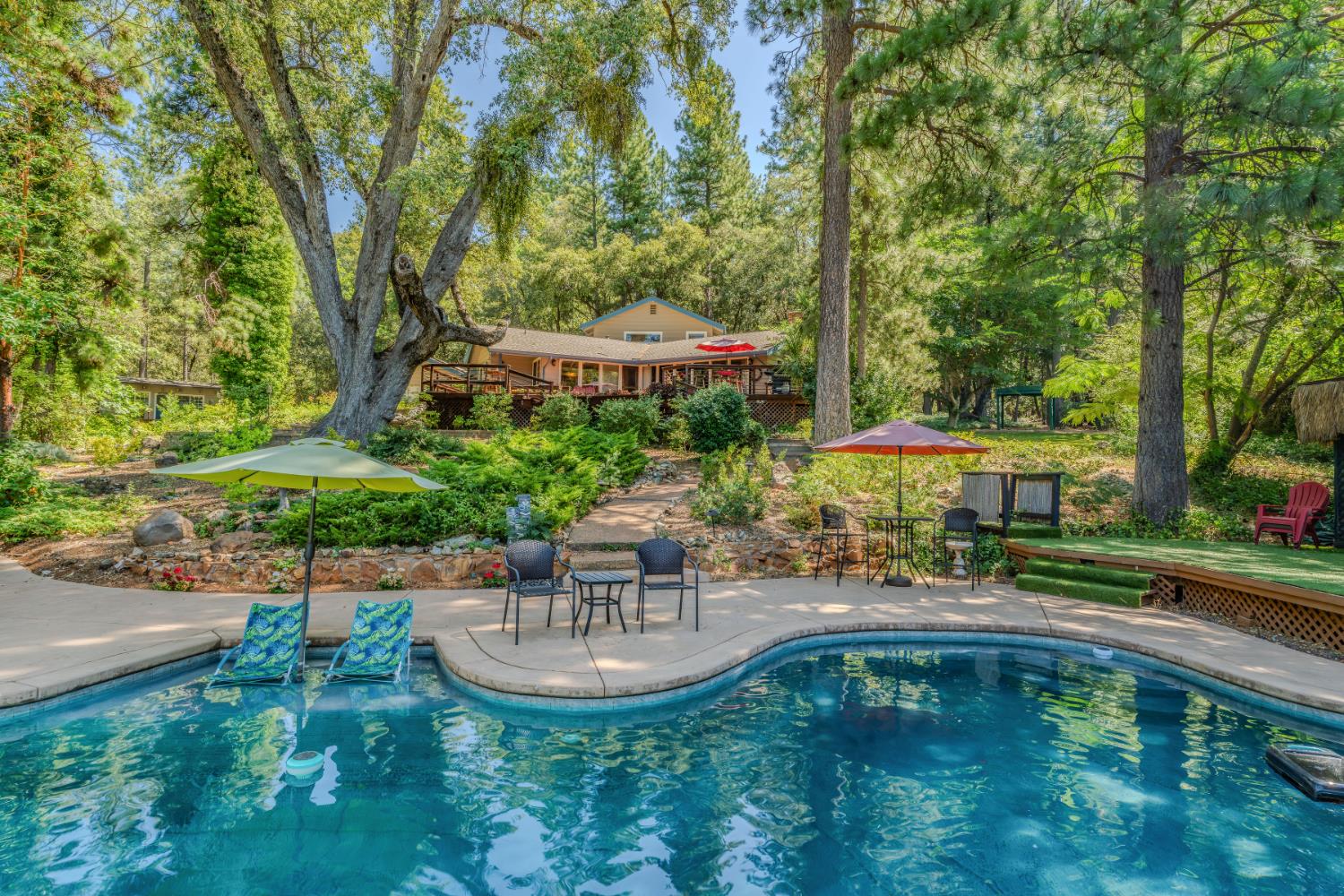 19630 Charleston Road Volcano, CA 95689 - Photo 11 of 70 a swimming pool with outdoor seating and yard