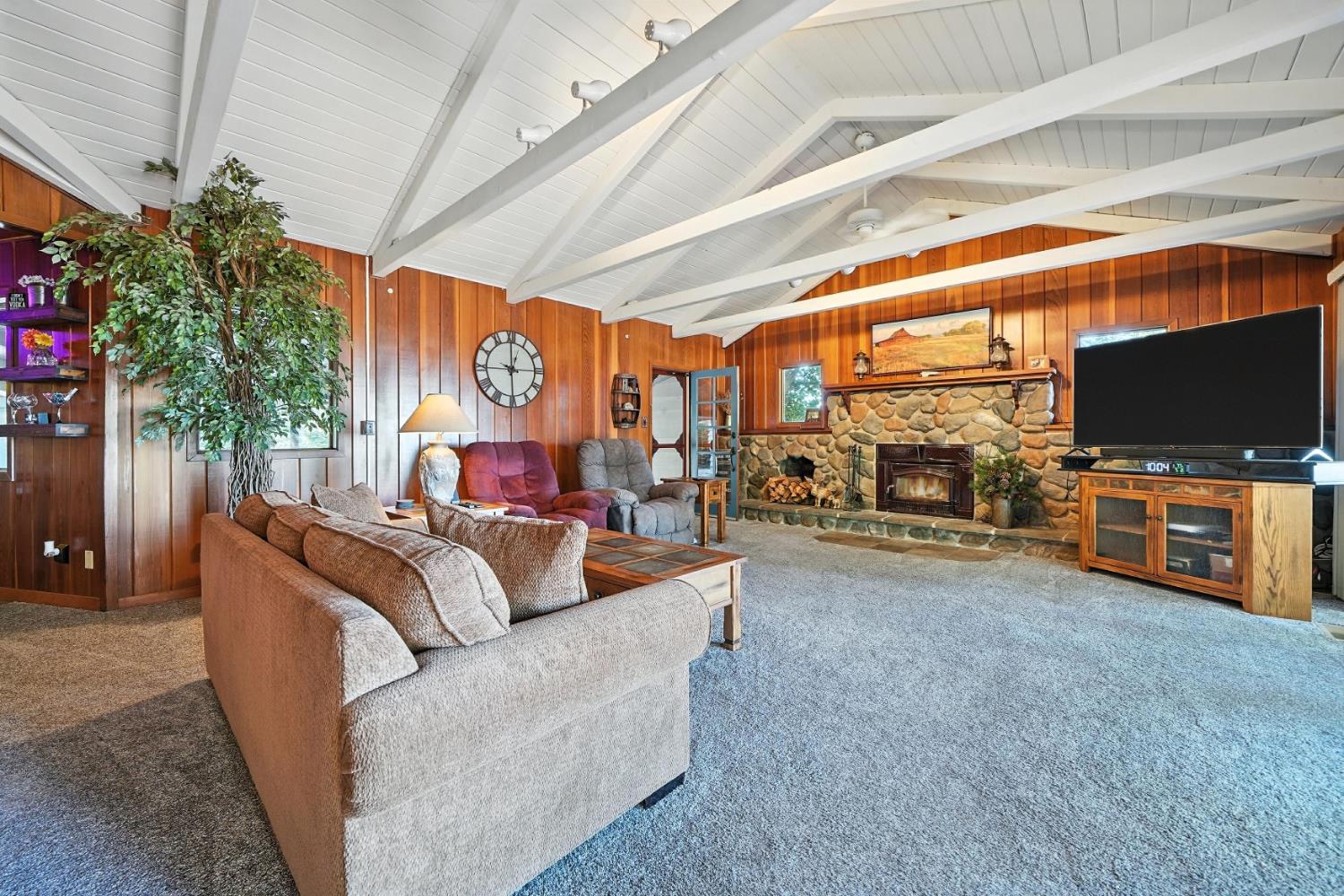 19630 Charleston Road Volcano, CA 95689 - Photo 15 of 70 a living room with furniture and a flat screen tv
