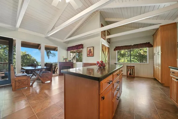 a bedroom with a bed a mirror and window