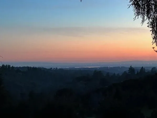 a backyard of a house with a yard and outdoor seating