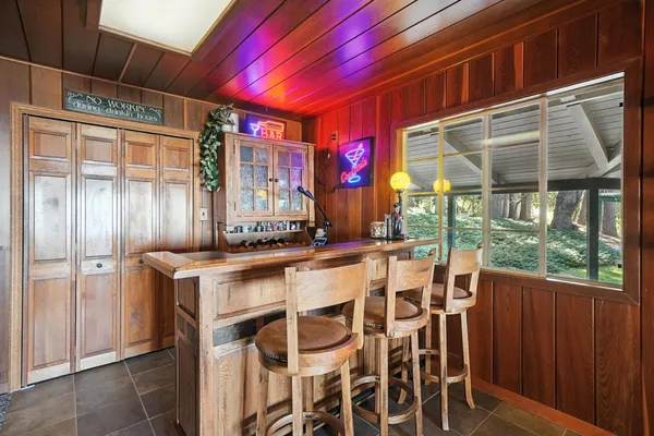 a bed room with a bed and a television