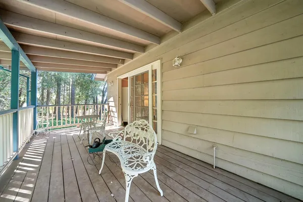 a view of a livingroom with workspace and a window