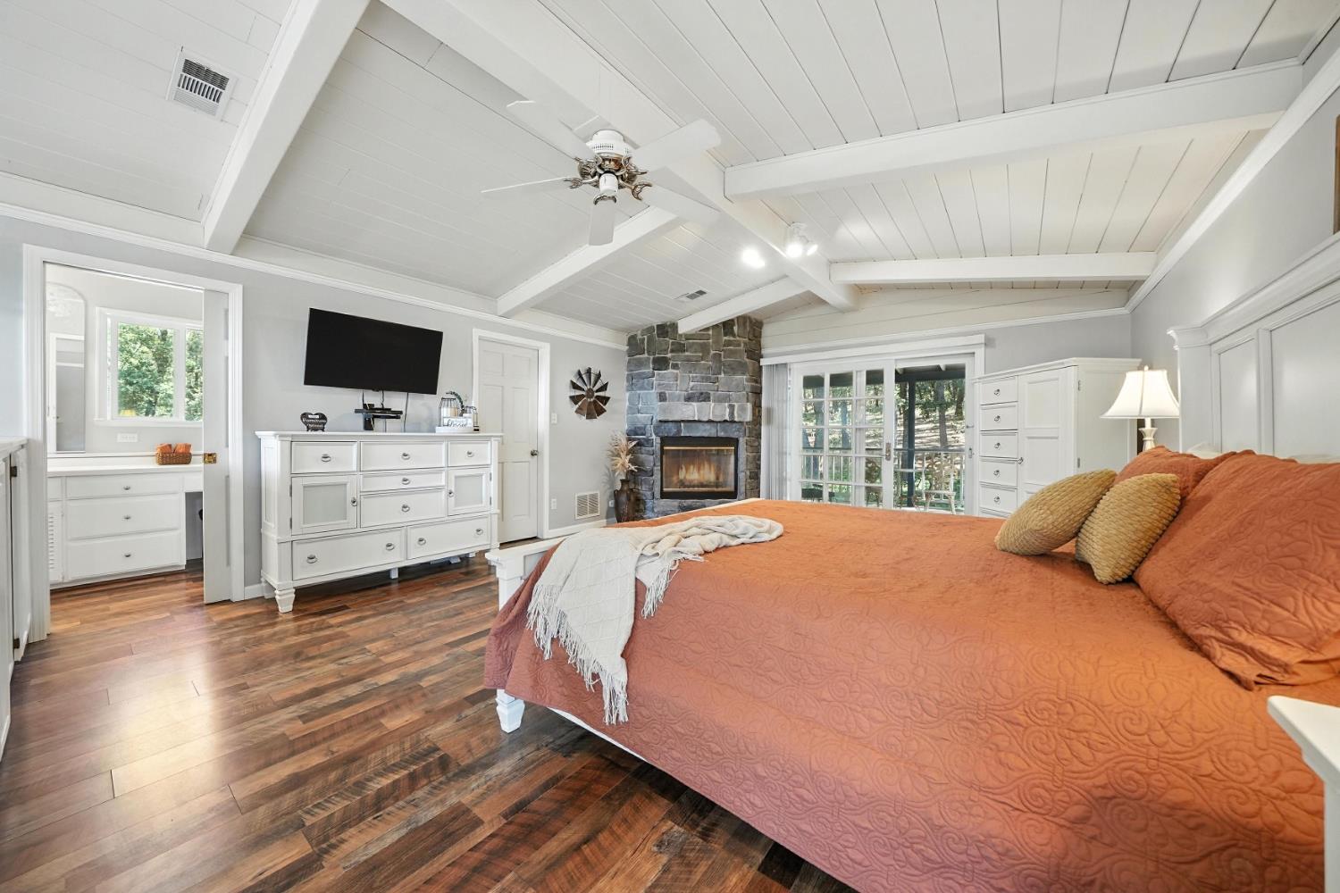 19630 Charleston Road Volcano, CA 95689 - Photo 39 of 70 a bedroom with a bed a flat screen tv and dresser