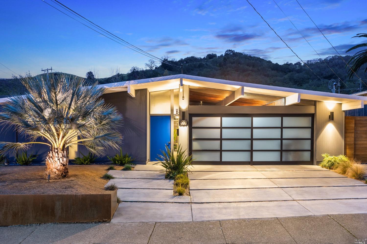 a front view of a house with a garage