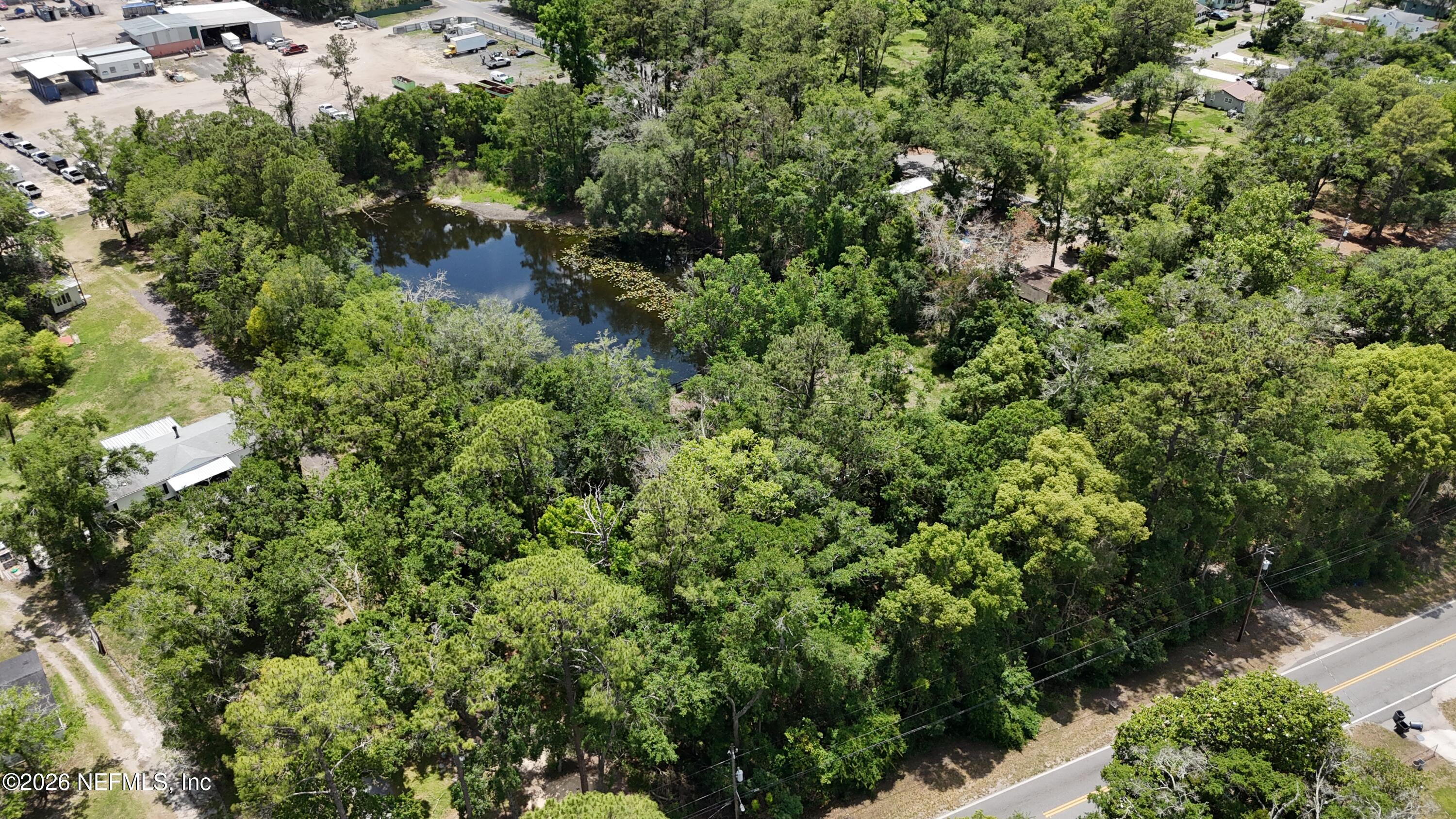 8048 Old Plank Road Jacksonville, FL 32220 - Photo 6 of 6 an aerial view of residential house with outdoor space and trees all around