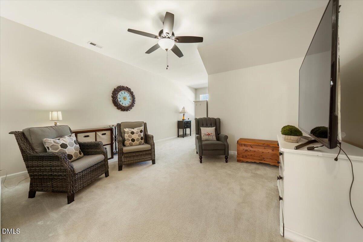 7328 Caversham Way Raleigh, NC 27617 - Photo 26 of 35 a living room with furniture and a large window