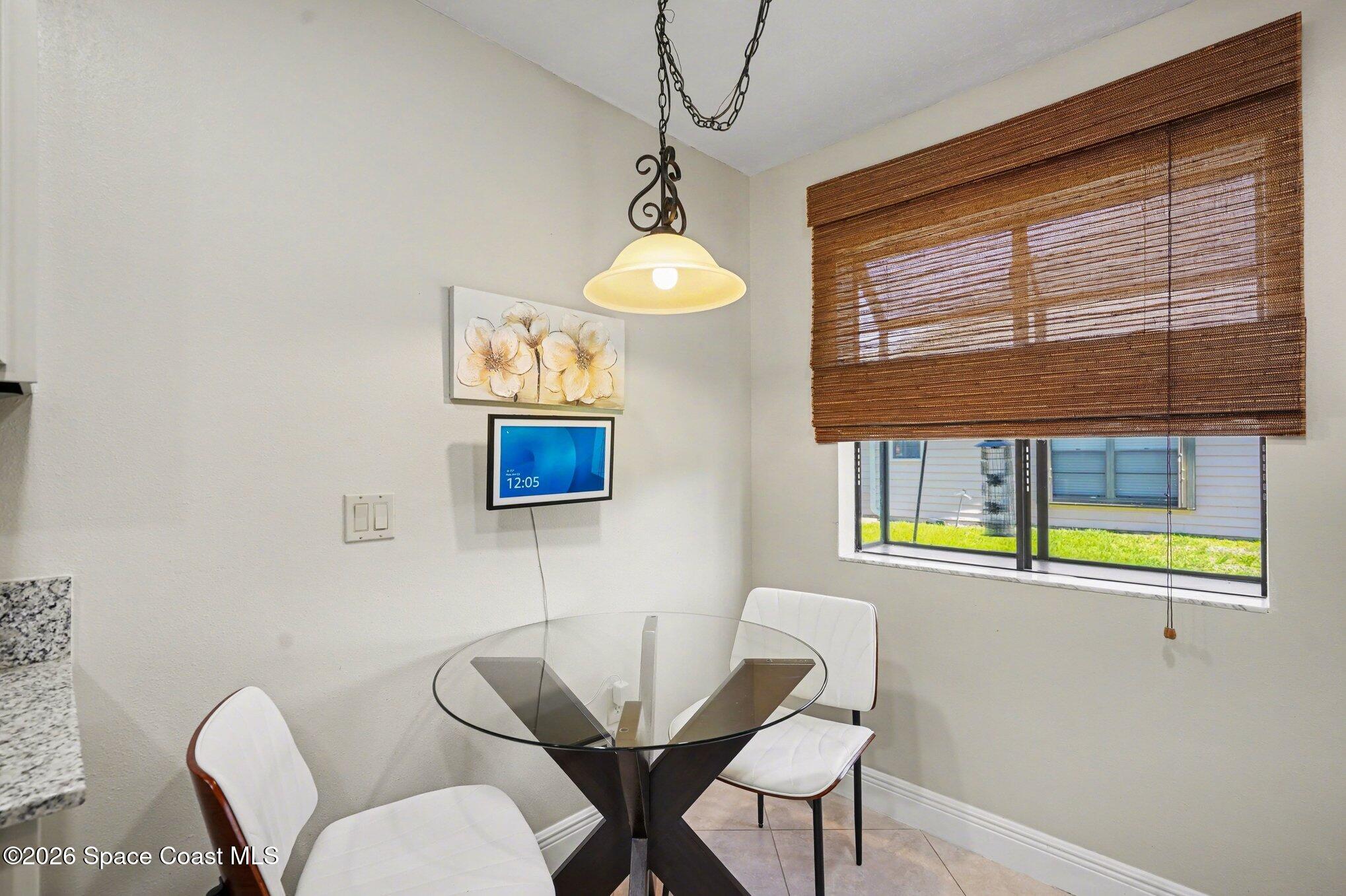 873 Ridge Lake Drive Melbourne, FL 32940 - Photo 12 of 27 a dining room with furniture and window
